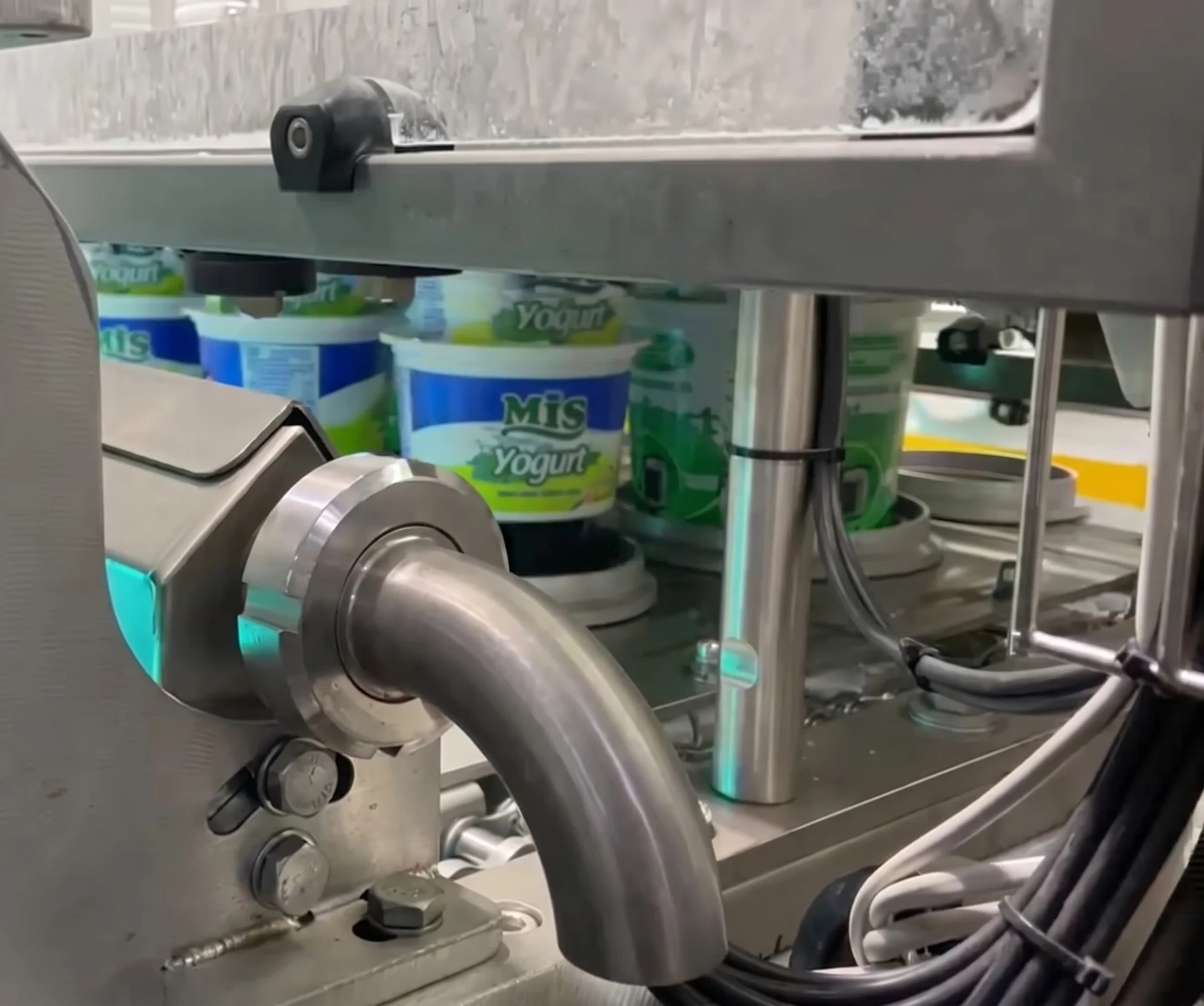 Finished yogurt cups coming off the dual-format line